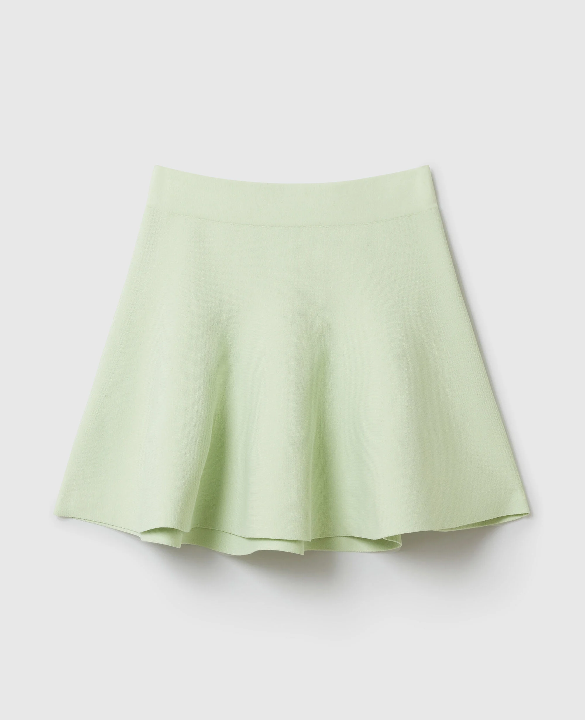 Compact Knit Peplum Mini Skirt