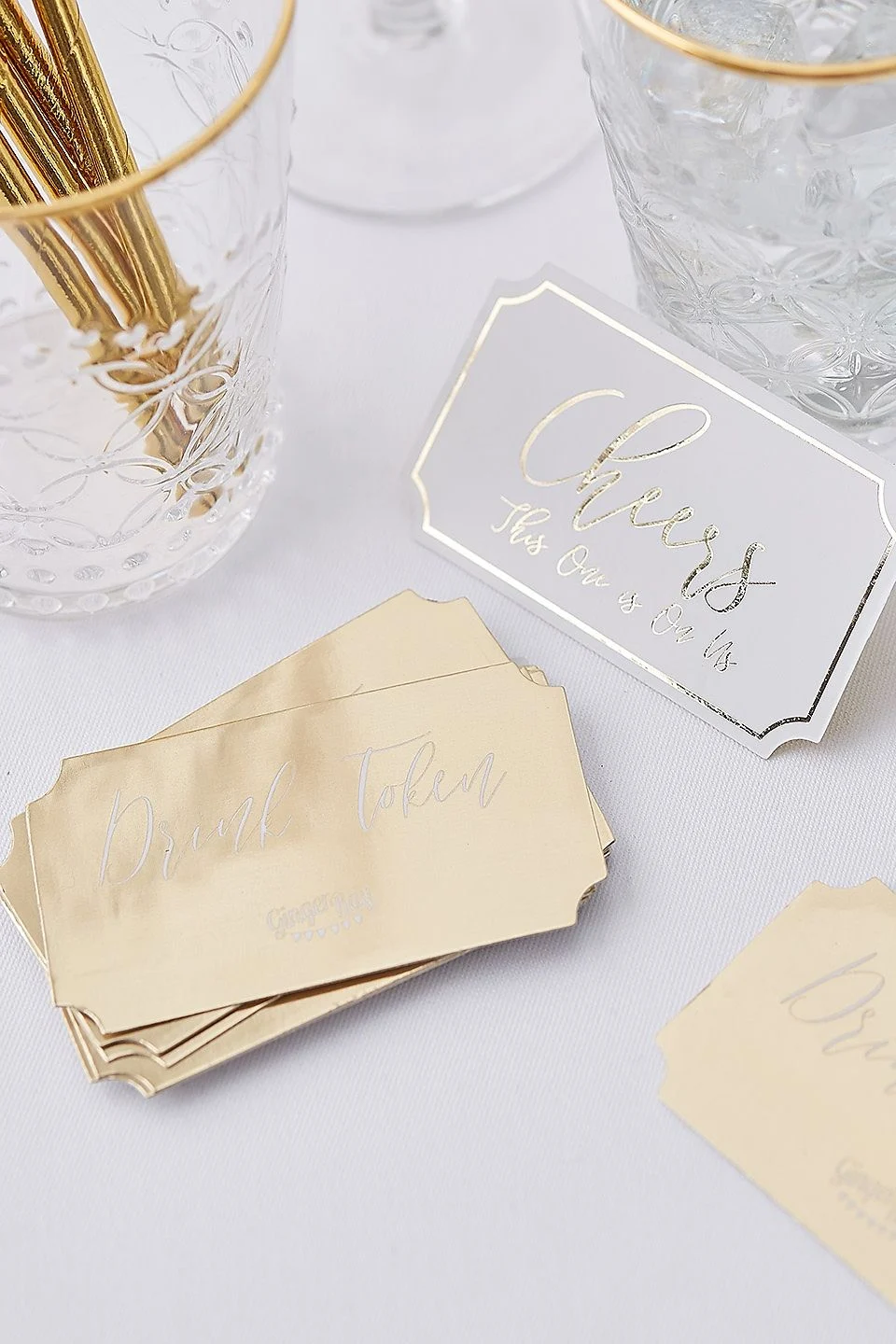 On Us Gold-Foil Drink Tokens